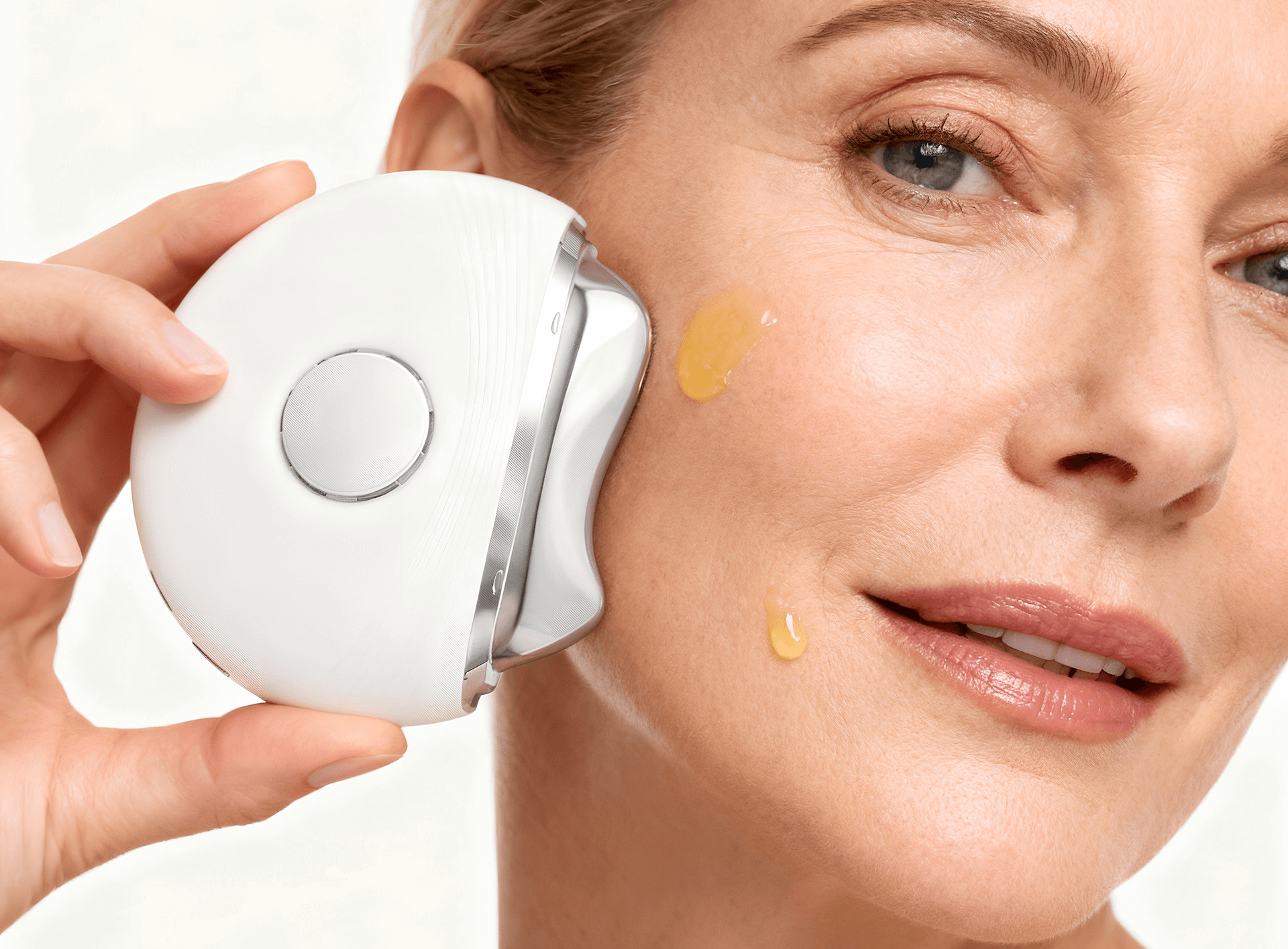 Pureance thermal beauty device gliding over face with serum applied