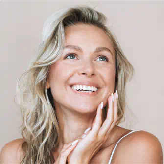 Smiling woman touching her face