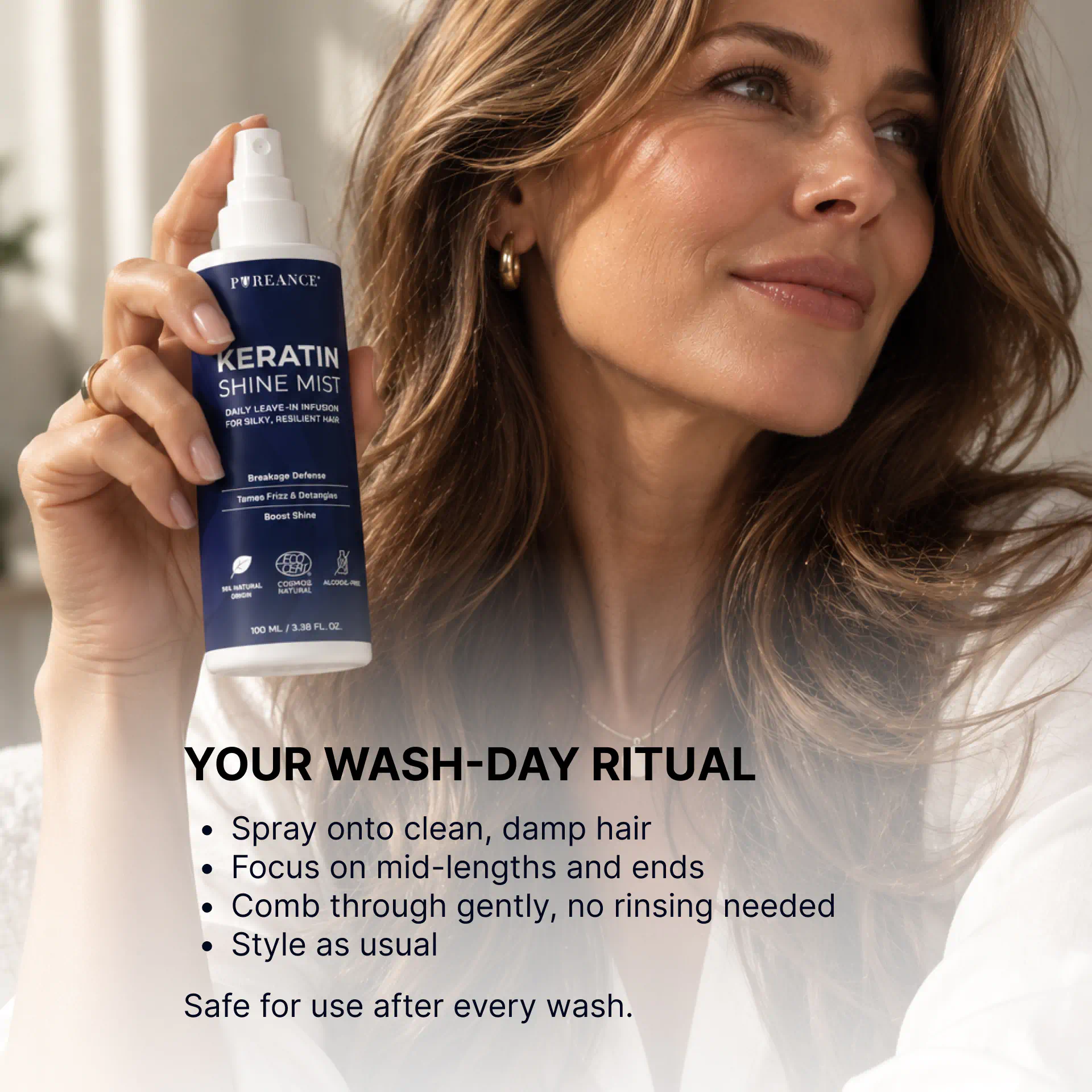 Woman holding Pureance keratin hair spray in wash-day ritual